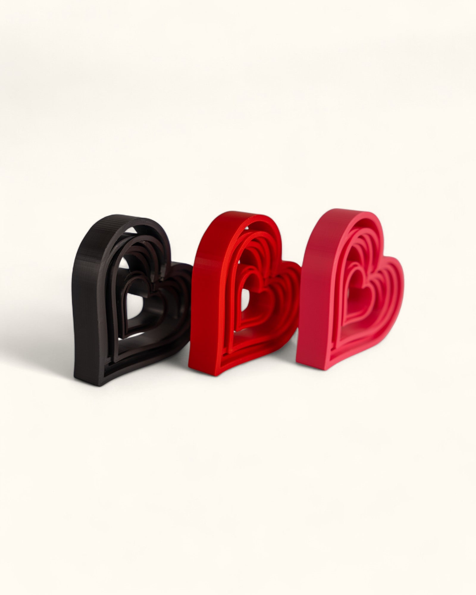 3D printed modern heart décor displayed in layered geometric style as standalone pieces for home or gift use.