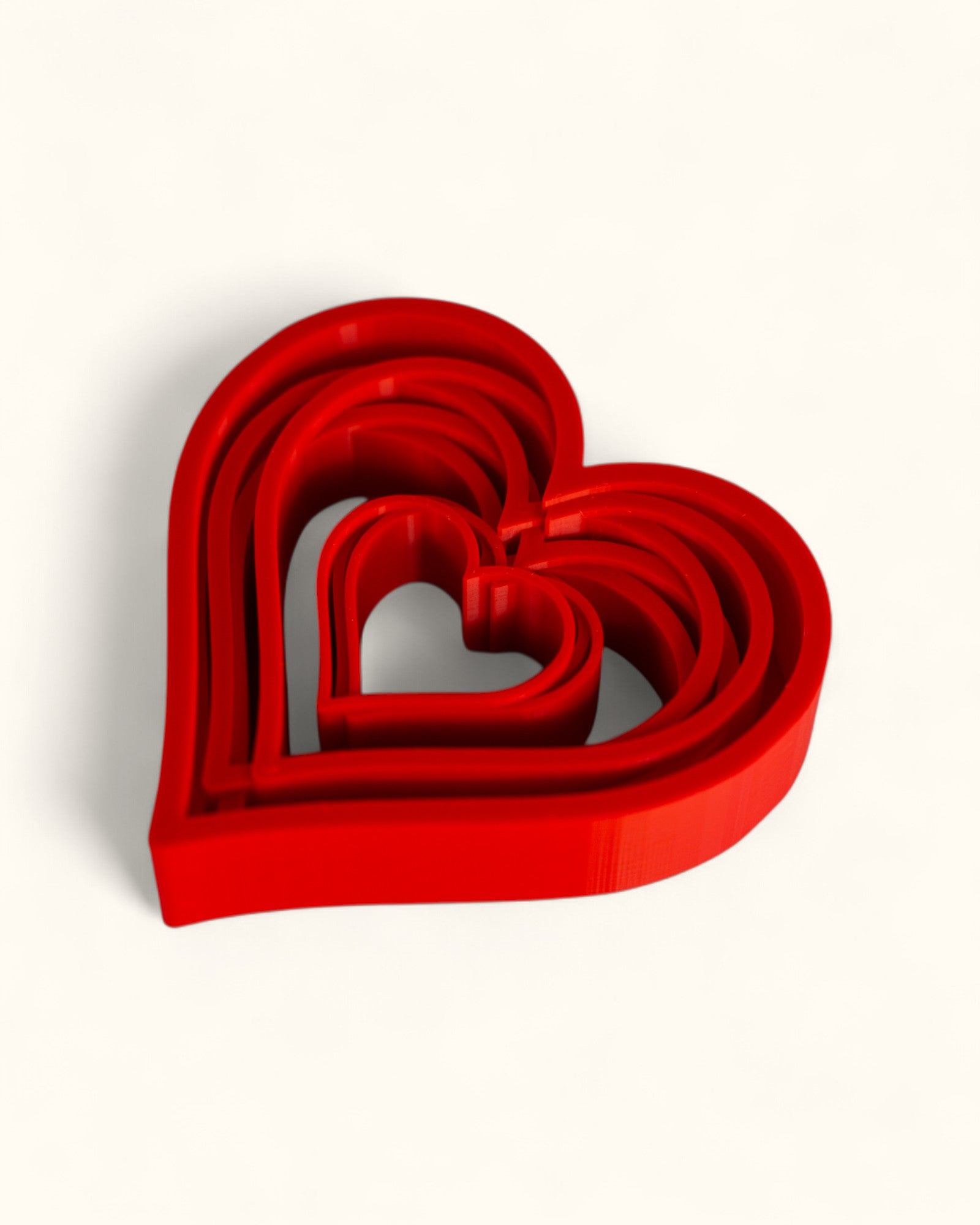 3D printed modern heart décor displayed in layered geometric style as standalone pieces for home or gift use.
