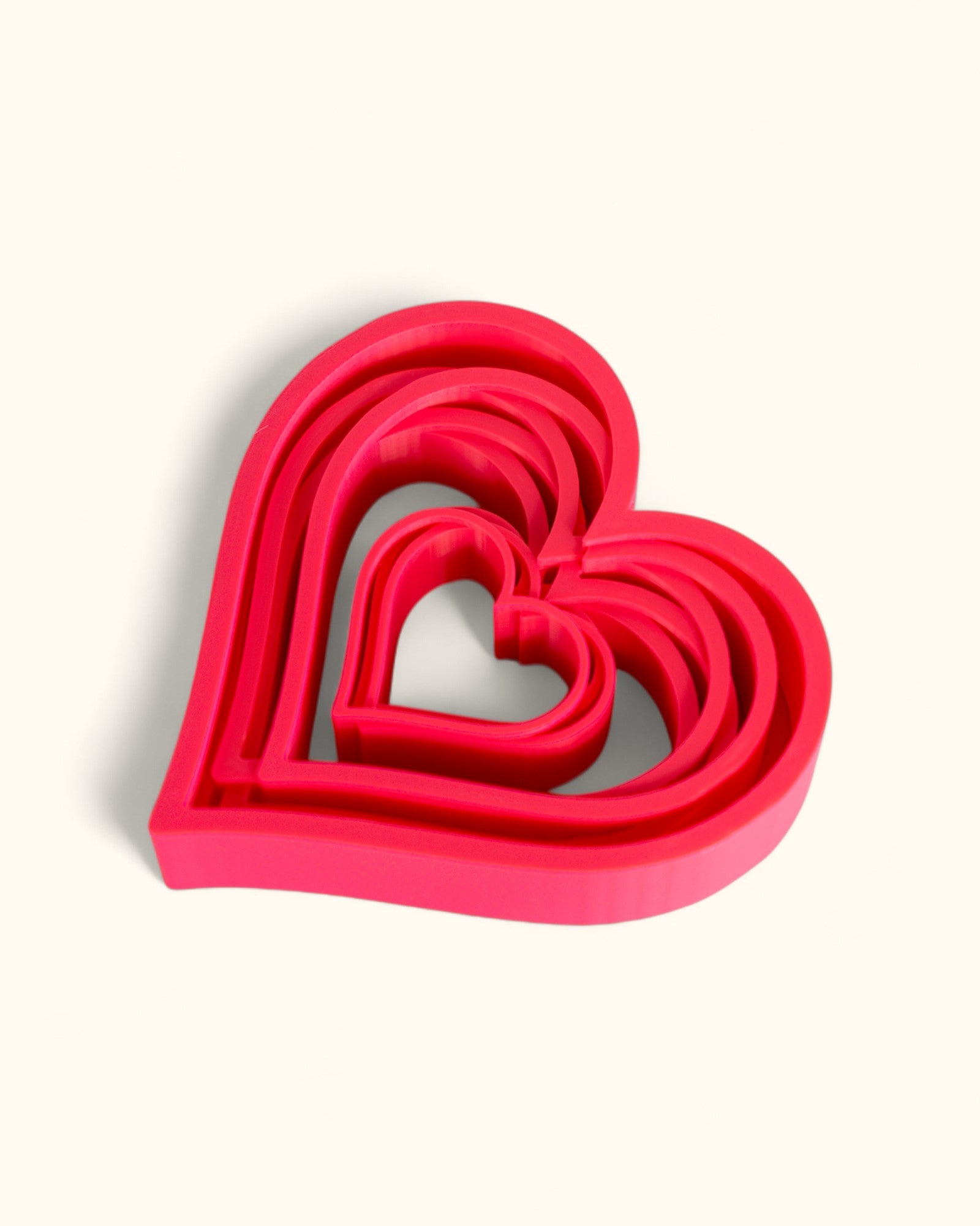 3D printed modern heart décor displayed in layered geometric style as standalone pieces for home or gift use.