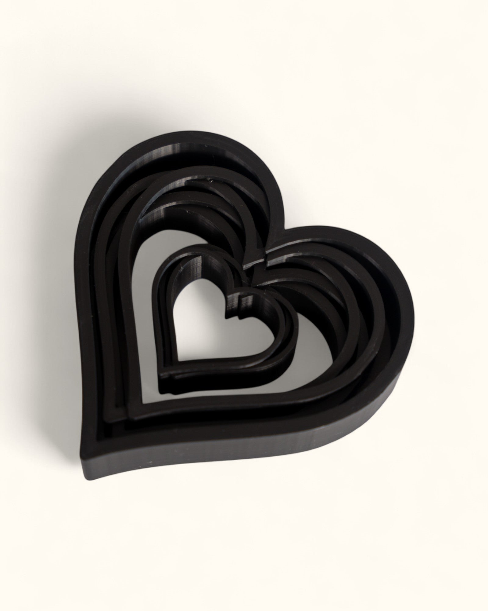 3D printed modern heart décor displayed in layered geometric style as standalone pieces for home or gift use.