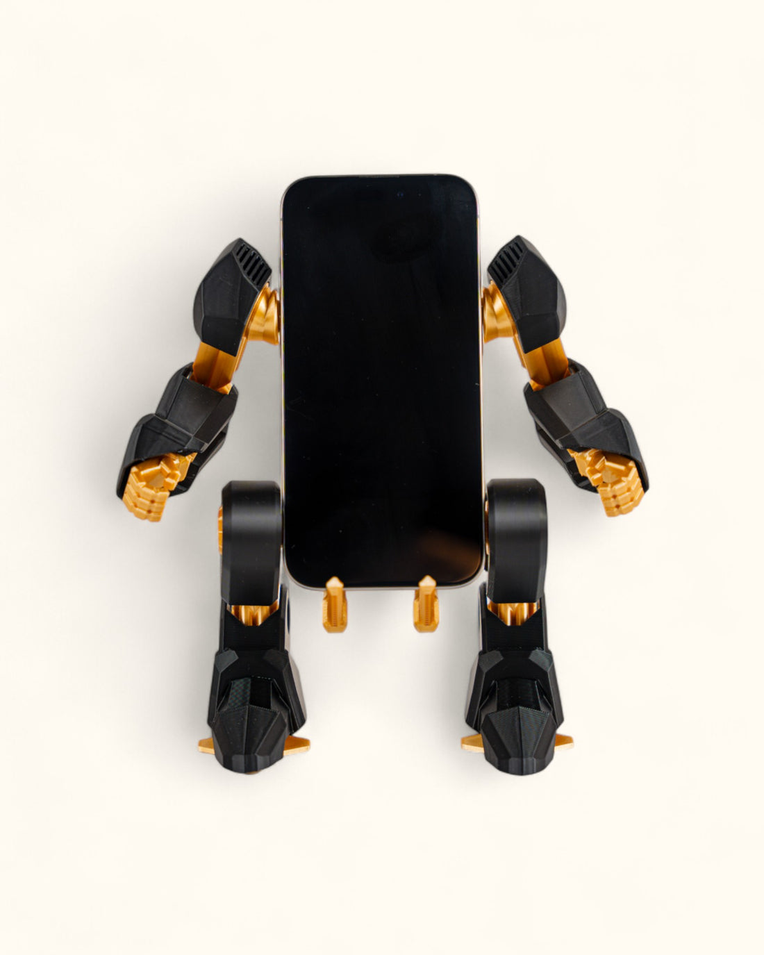 3D-printed mech-inspired phone stand with detailed armour plates, gear design, and hand feature for holding a charging cable, adjustable to fit most modern smartphones.