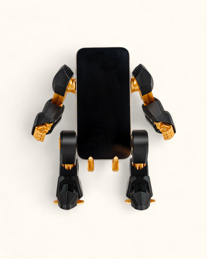 3D-printed mech-inspired phone stand with detailed armour plates, gear design, and hand feature for holding a charging cable, adjustable to fit most modern smartphones.