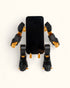 3D-printed mech-inspired phone stand with detailed armour plates, gear design, and hand feature for holding a charging cable, adjustable to fit most modern smartphones.