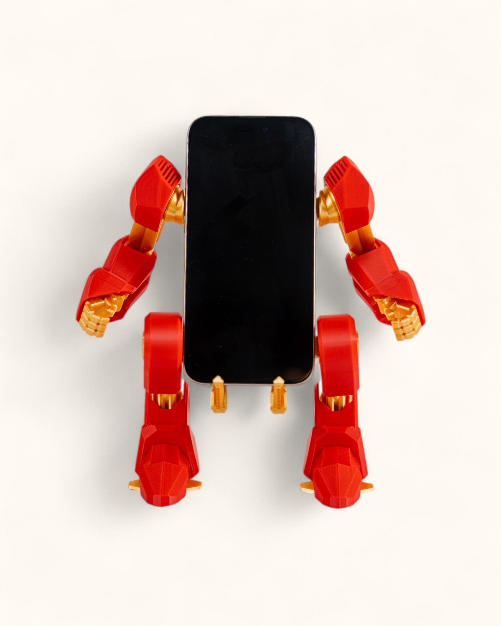 3D-printed mech-inspired phone stand with detailed armour plates, gear design, and hand feature for holding a charging cable, adjustable to fit most modern smartphones.