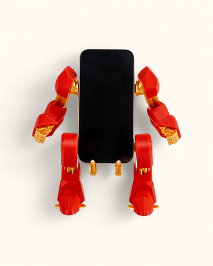 3D-printed mech-inspired phone stand with detailed armour plates, gear design, and hand feature for holding a charging cable, adjustable to fit most modern smartphones.
