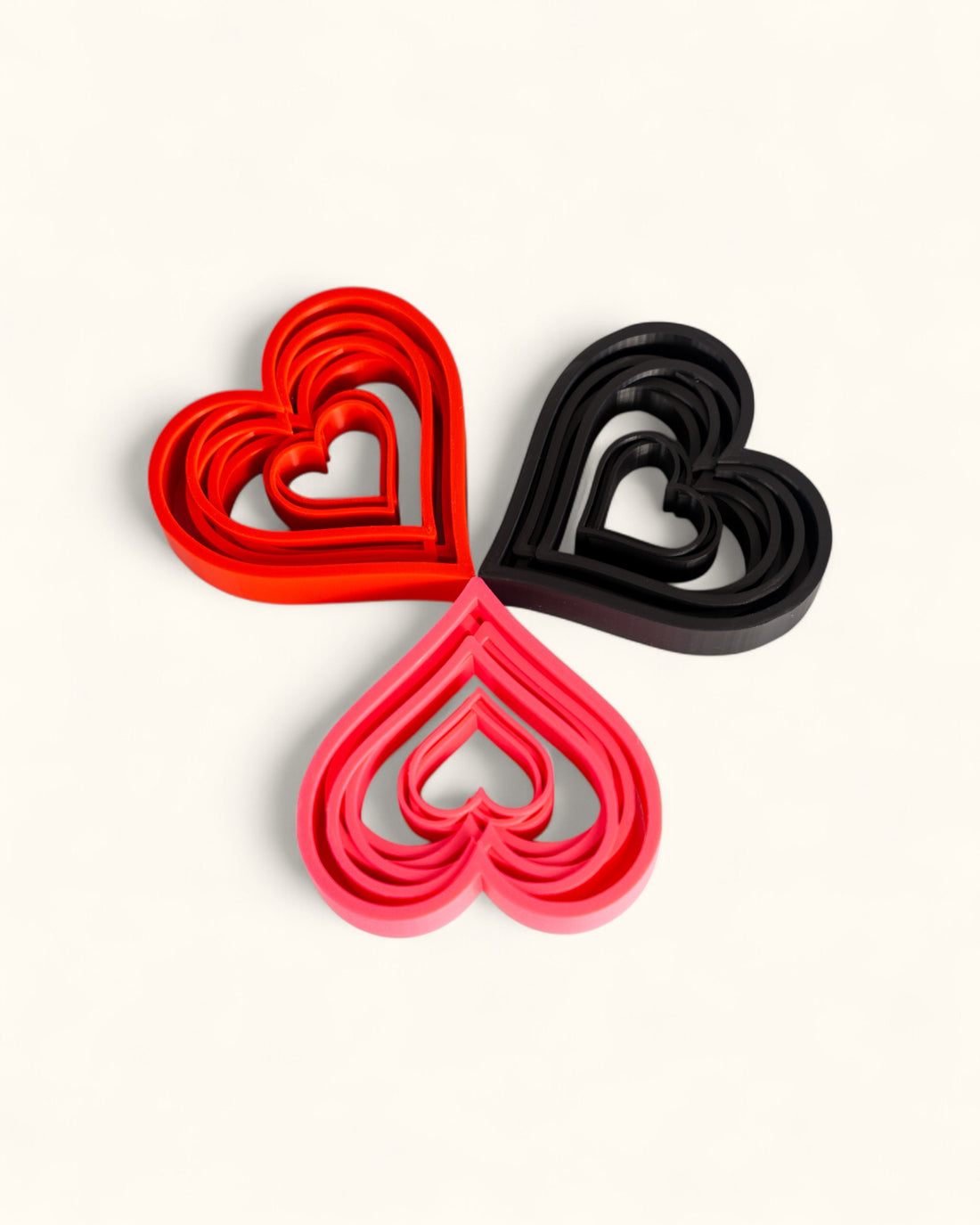 3D printed modern heart décor displayed in layered geometric style as standalone pieces for home or gift use.